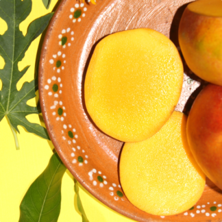 sliced mangoes on a clay plate